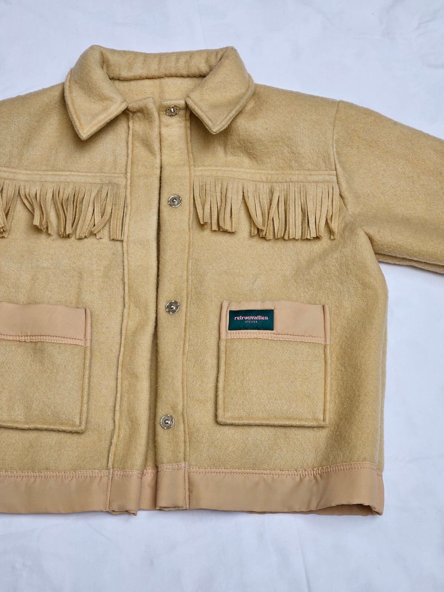 Veste couverture à franges