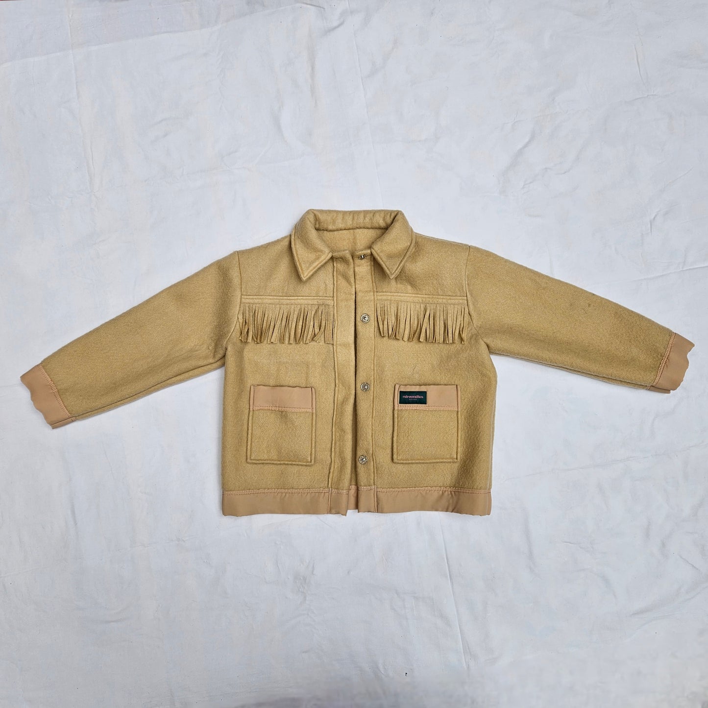 Veste couverture à franges