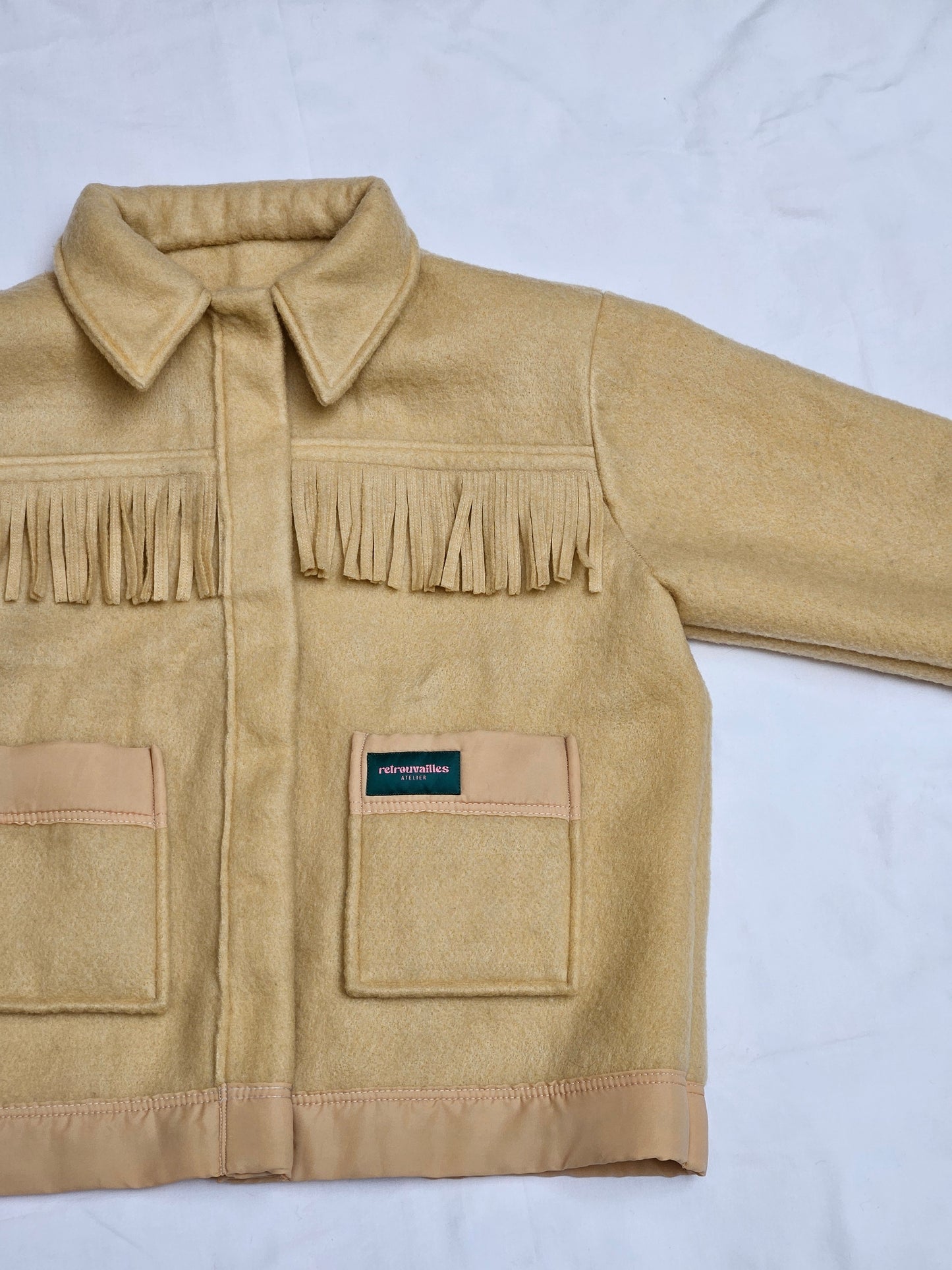 Veste couverture à franges
