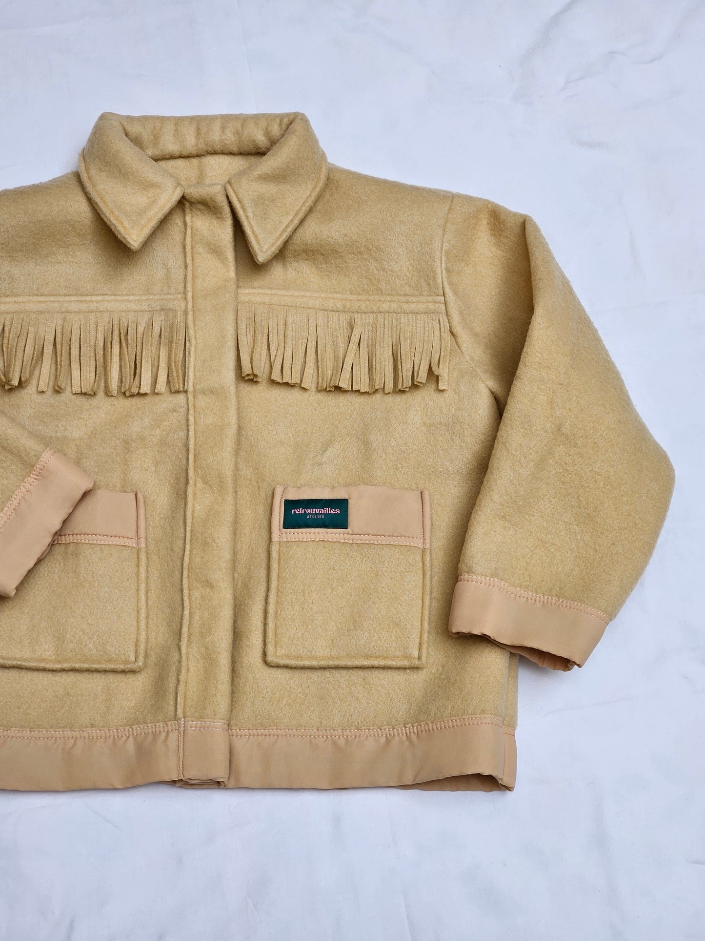 Veste couverture à franges