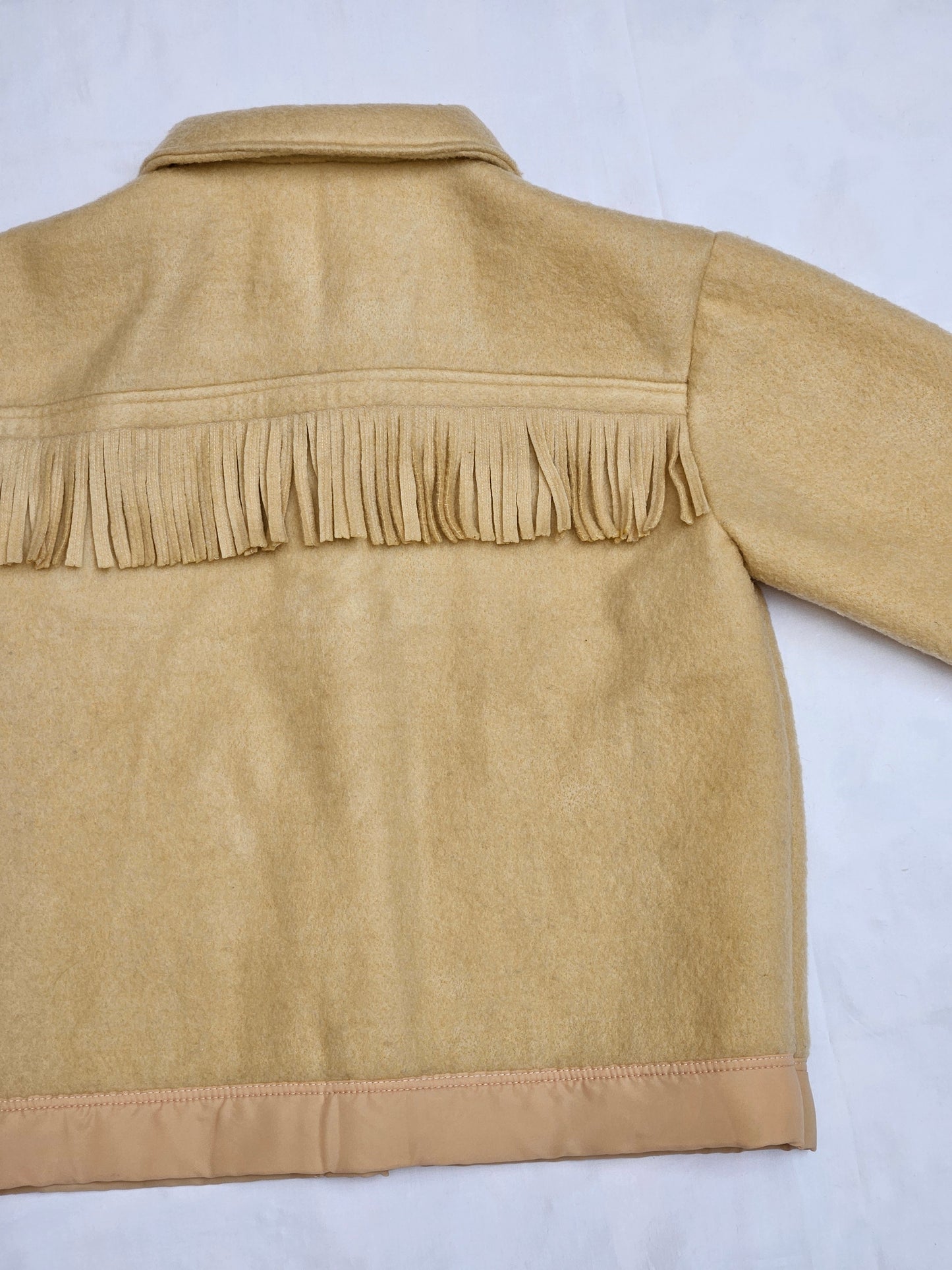 Veste couverture à franges