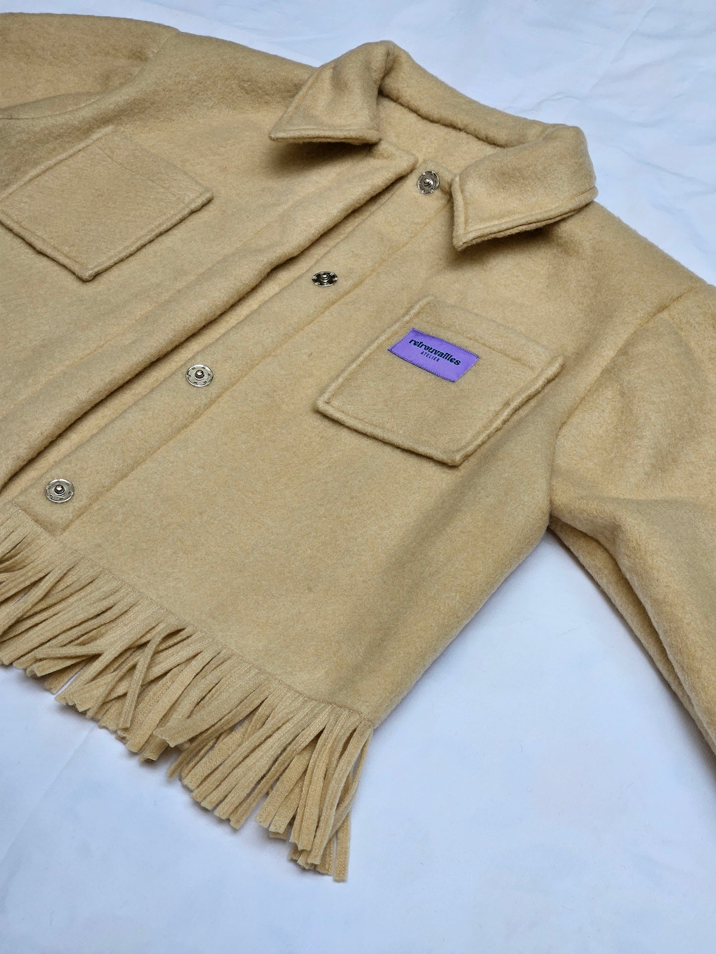 Veste couverture à franges