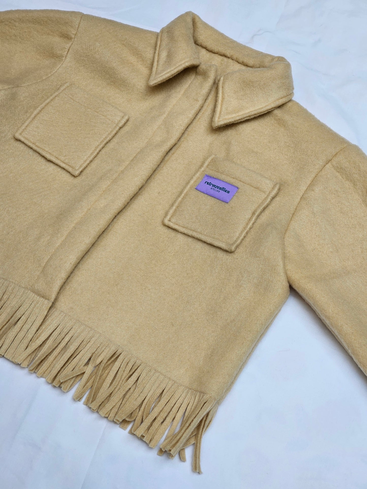 Veste couverture à franges