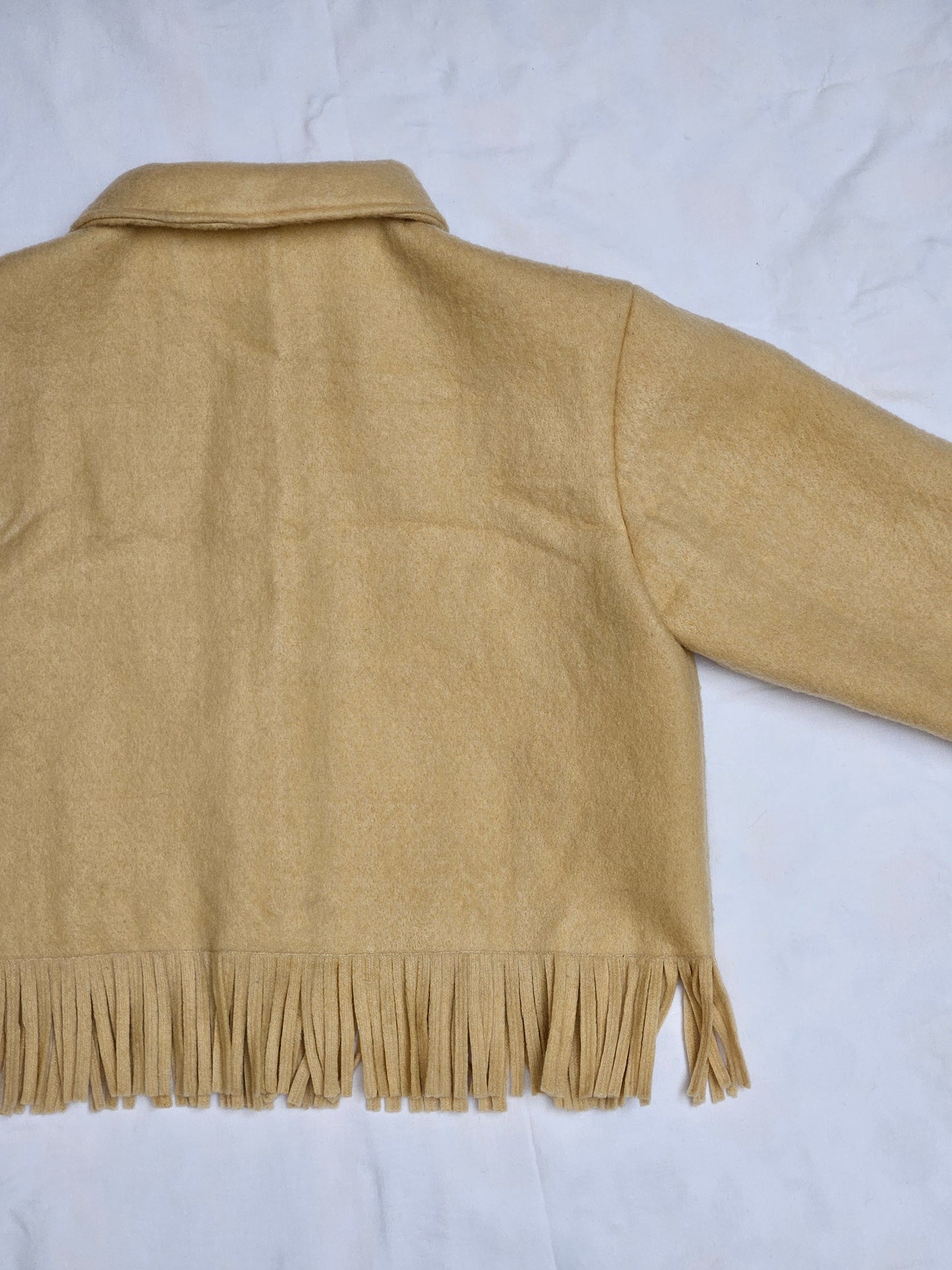 Veste couverture à franges