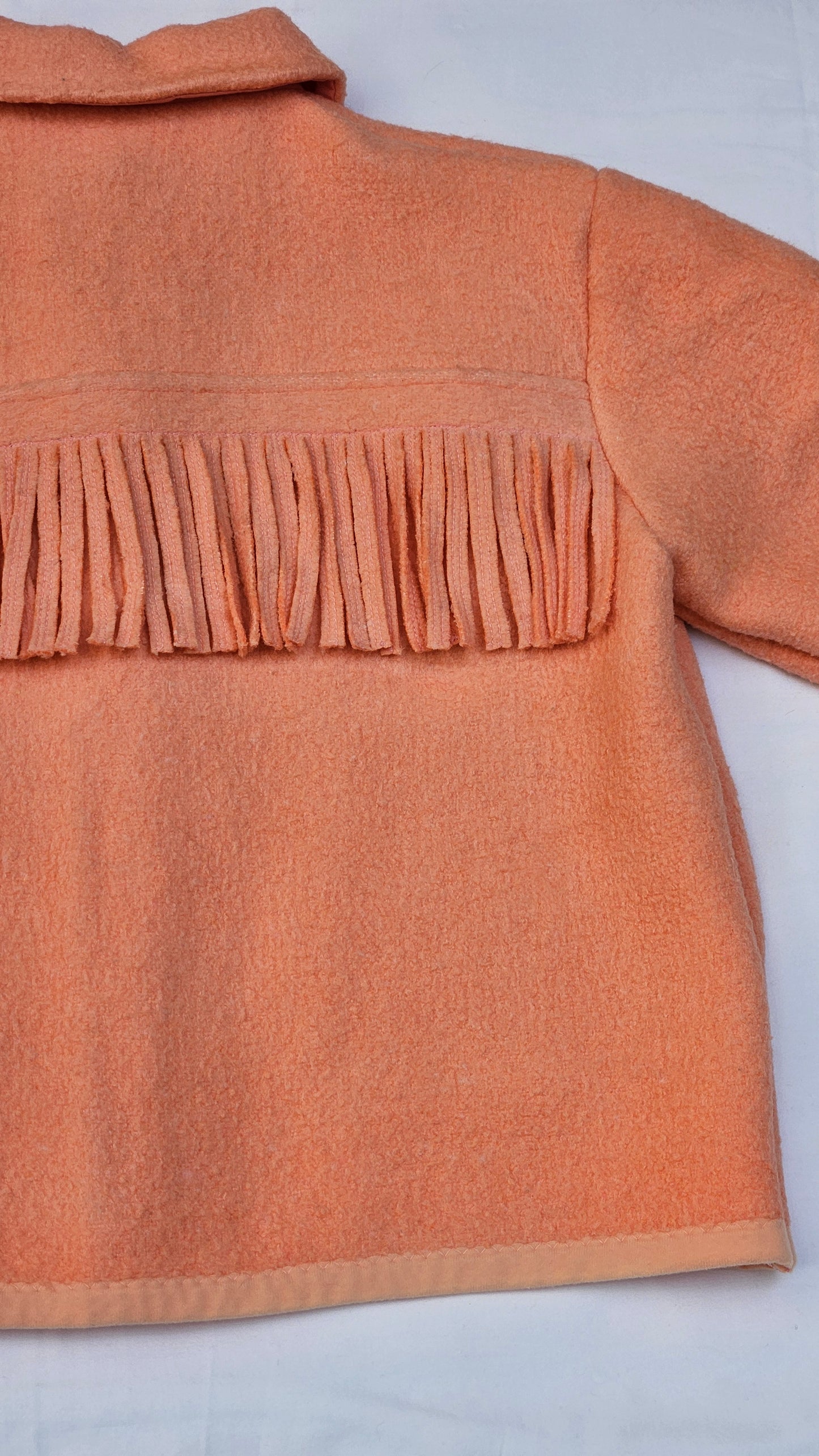 Veste couverture à franges
