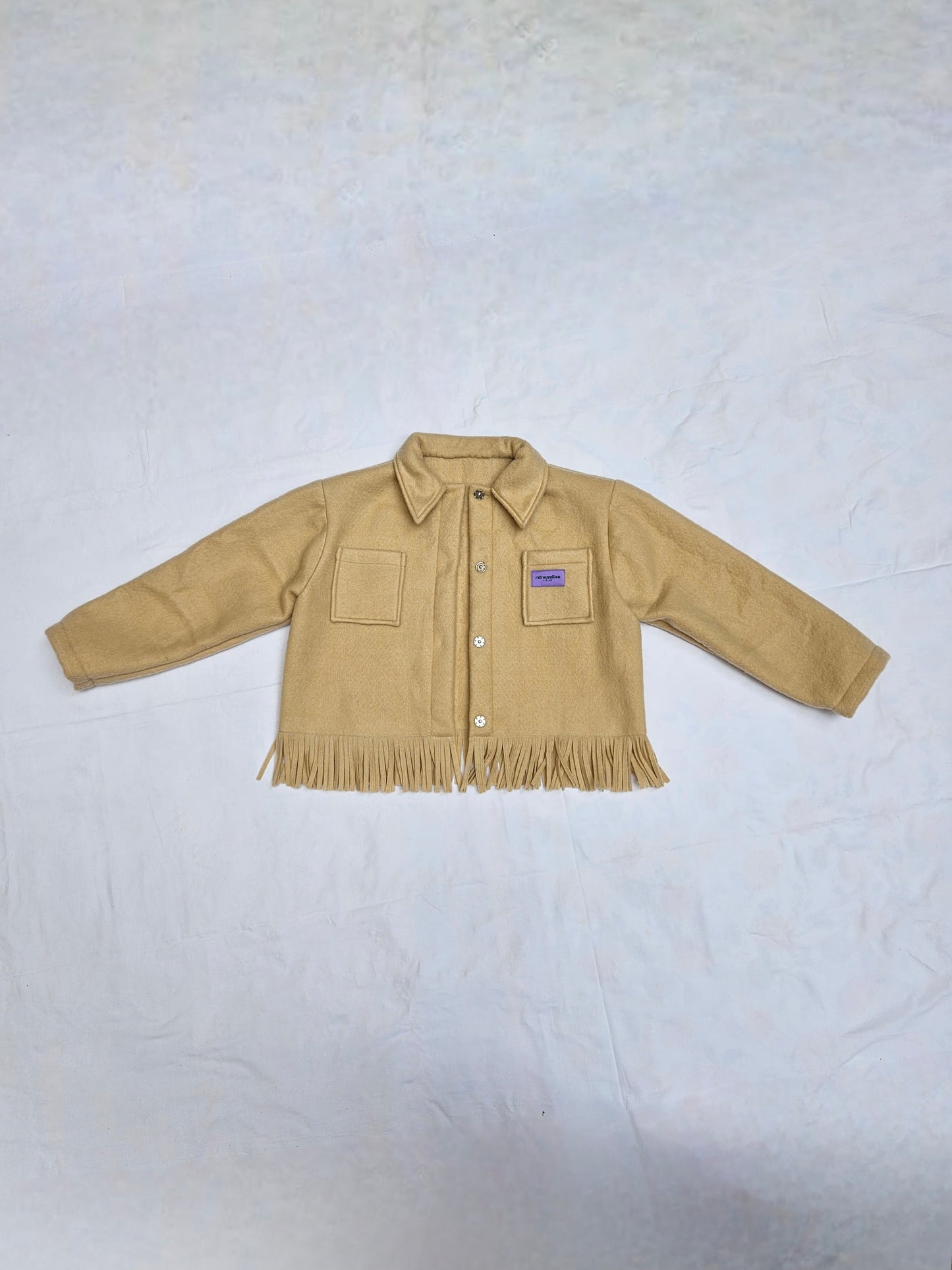 Veste couverture à franges