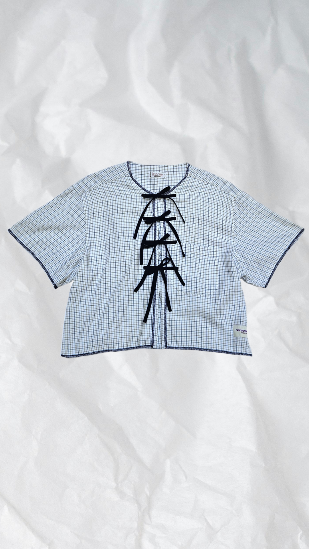 Blouse à carreaux à nouer